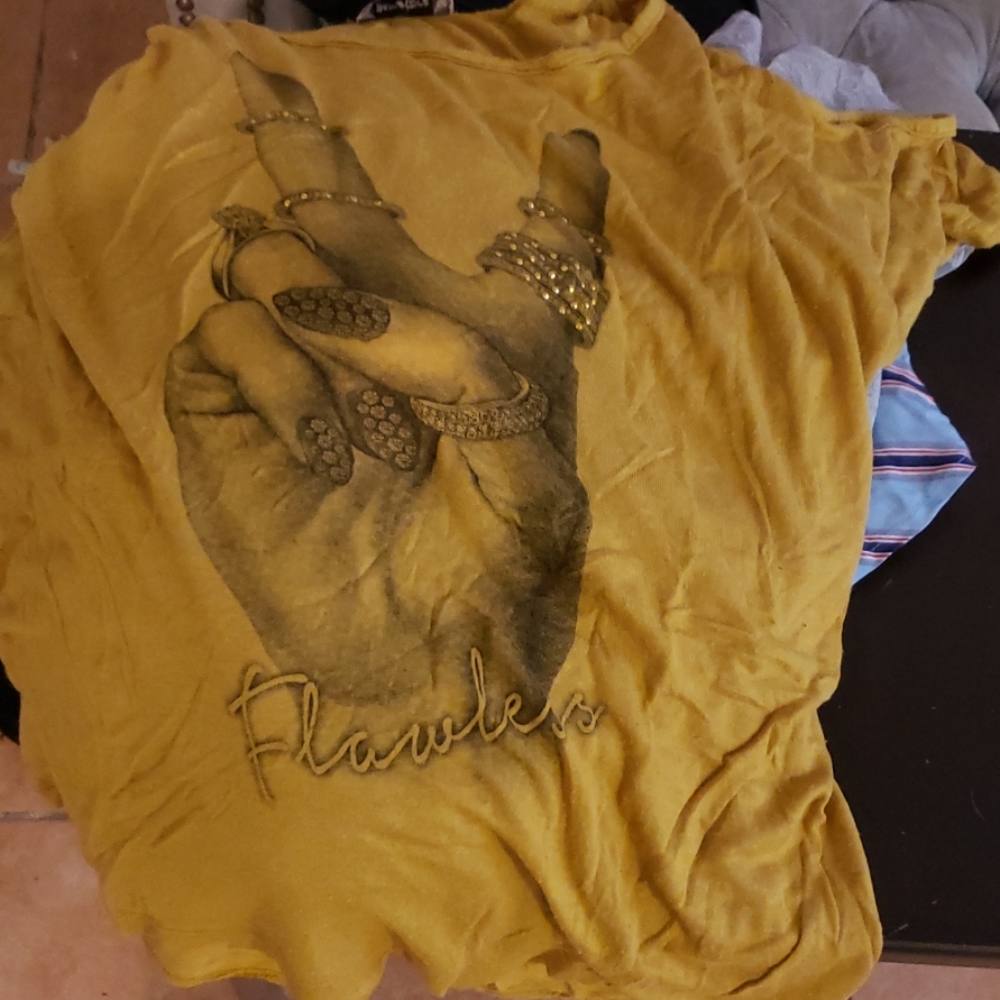 Yellow shirt that say flawless